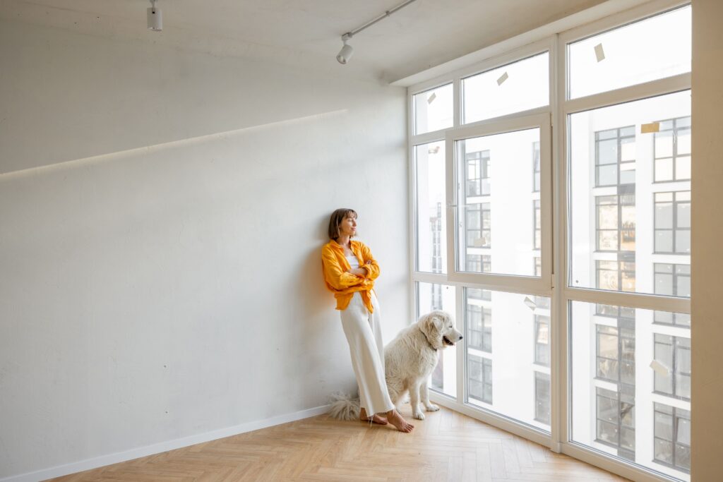 woman-with-dog-in-new-apartment